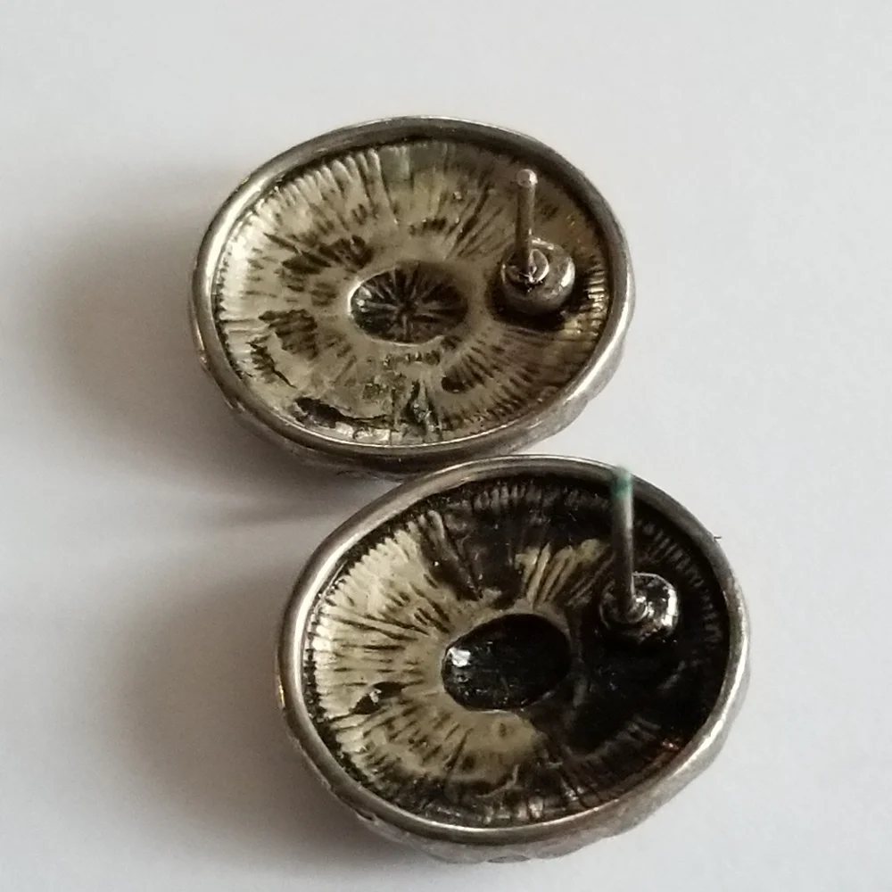Earrings Silver tone earrings oval stud scrolled design